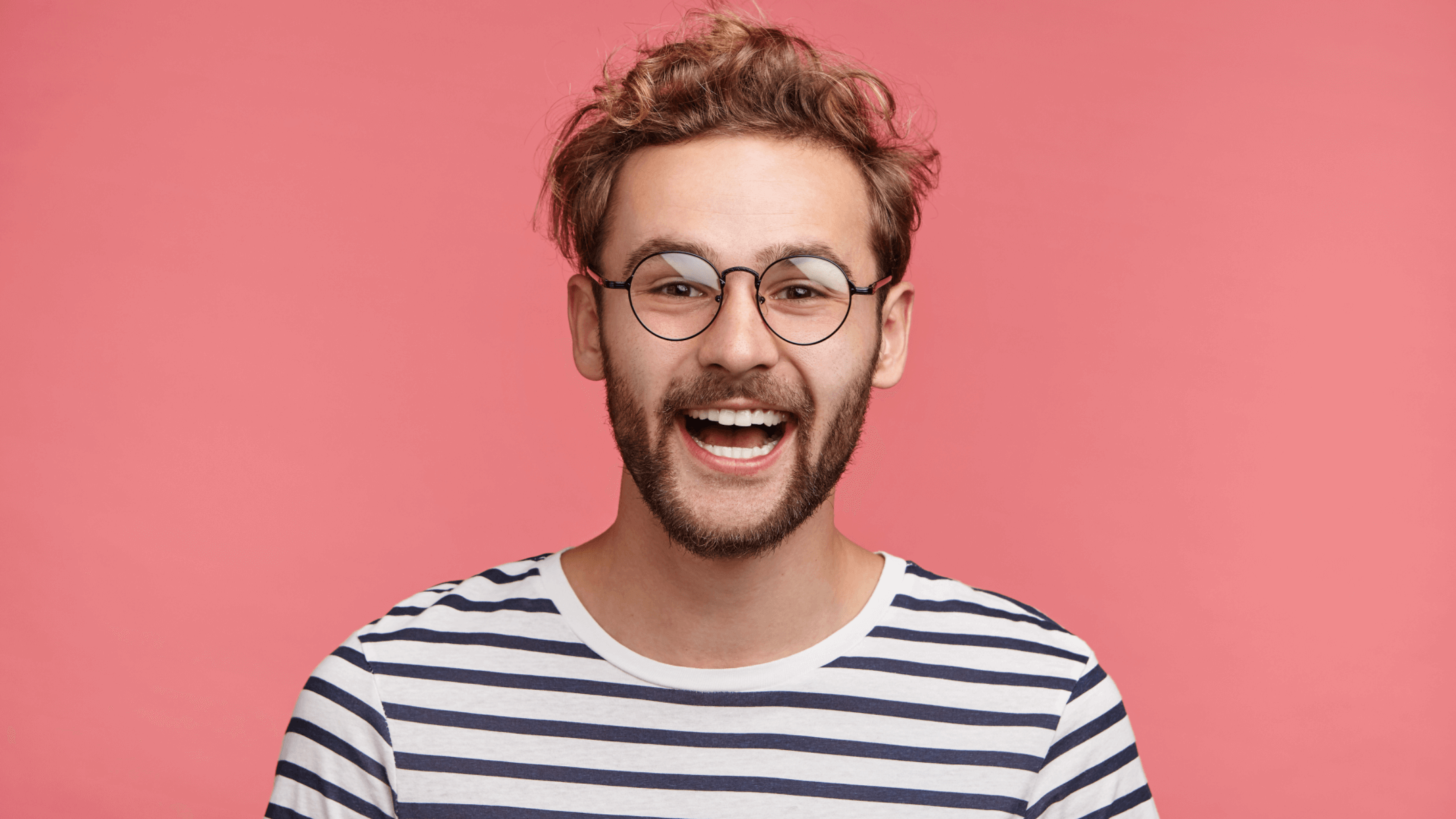man with glasses on smiling